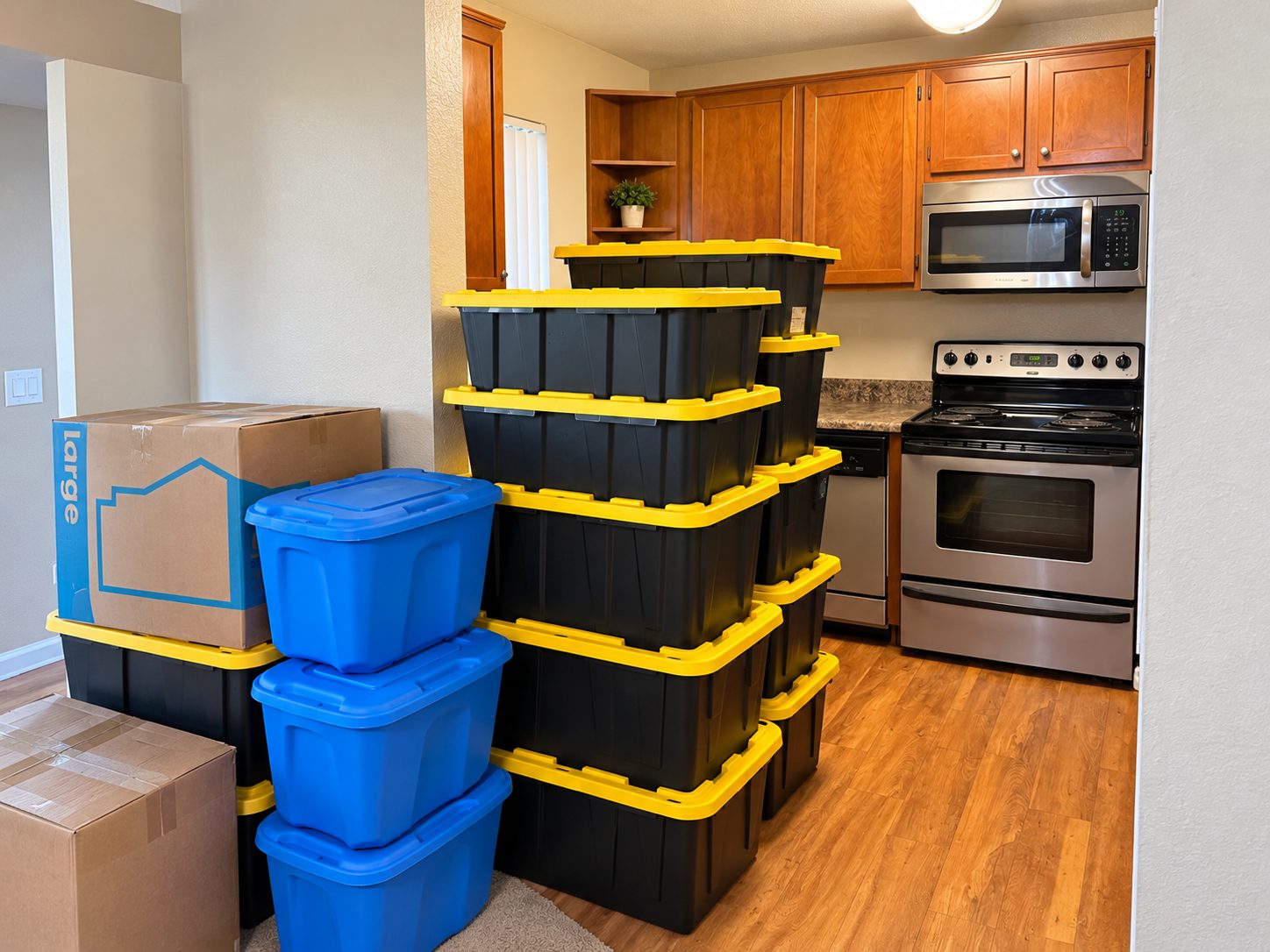 Neatly stacked packing bins ready for transport in a customer kitchen